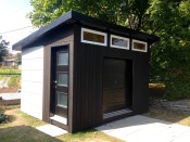 Check out this gorgeous build by Sam, in Quebec. He writes "There isn't pre-made cement boards available in Quebec, Canada so we used Hardiebacker that we cut and painted ourselves. As for the wood, it's cedar planks that I've burnt with a roof torch, brushed and then applied a natural tung oil for maximum protection." He also writes "...[the] neighbors are jealous. :)" Rightly so! This is an amazing build. I love the finishing on the underside of the soffit (don't forget to vent!) and the burned/ oiled finish on the vertical siding boards.