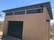Paul, in Tucson created this shed to use as a woodworking shop; He added insulation and electricity and stucco siding. I love the sleek modern windows along the extended front wall.